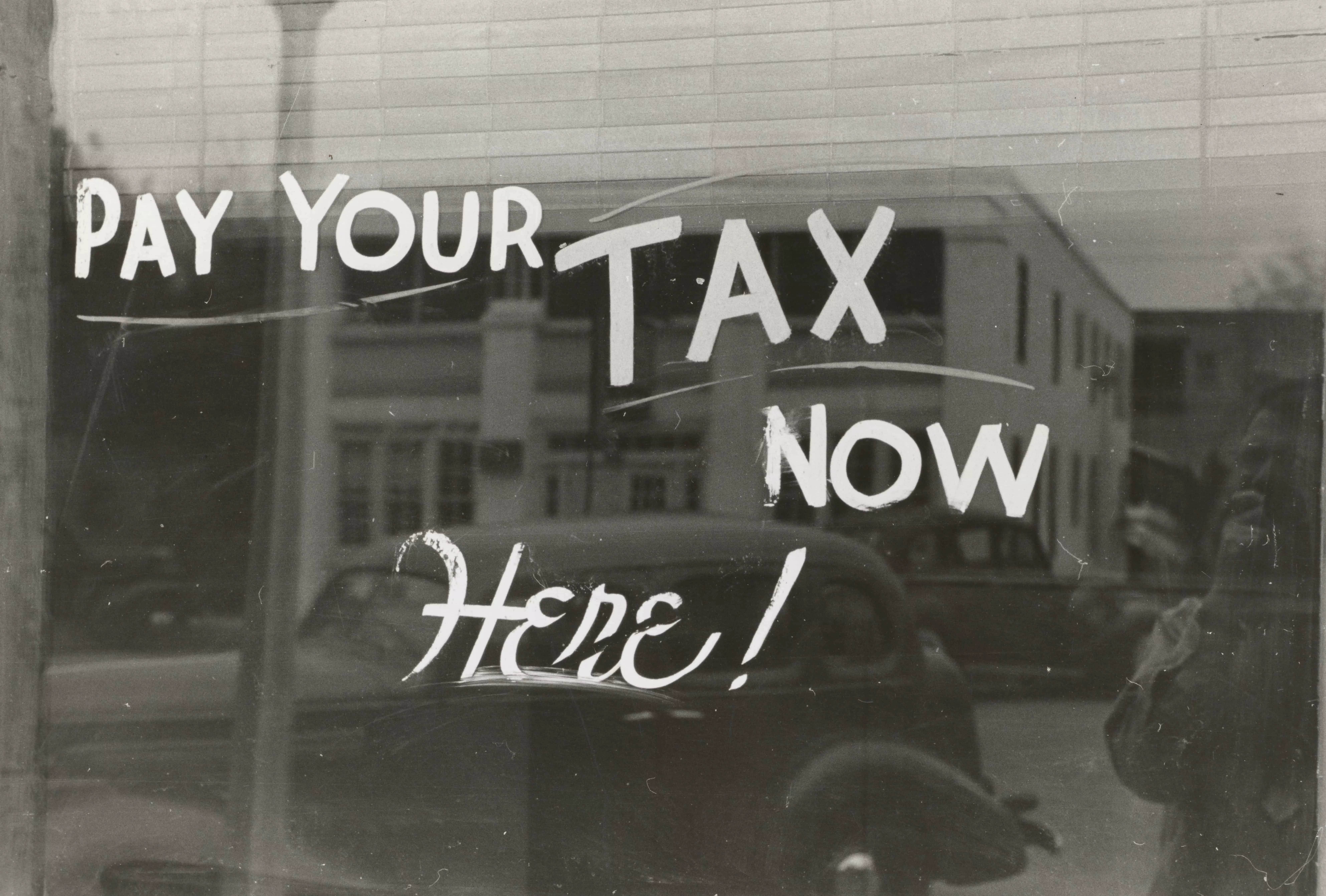 old sign for taxes on cars